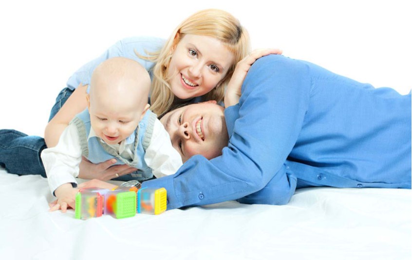 baby-boy-with-parents-playing